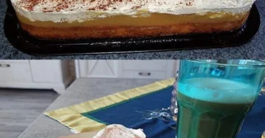 Apfel-Sahne-Kuchen mit frischen Äpfeln und Sahne auf einem Teller