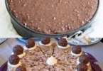 Leckere Ferrero Rocher Torte ohne Backen mit Schokoladenschicht und Nüssen.