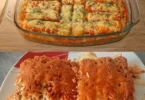 Fischstäbchen serviert mit Reis und Tomaten auf einem Teller