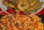 Leckere Nudeln mit Hackfleisch und frischem Gemüse auf einem Teller