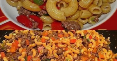 Leckere Nudeln mit Hackfleisch und frischem Gemüse auf einem Teller