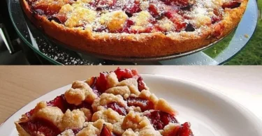 Leckeres Stück Pflaumenkuchen mit frischen Pflaumen auf einem Teller