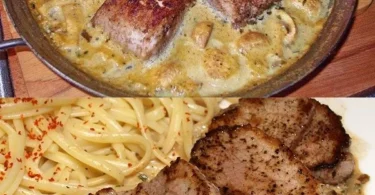 Schweinefilets in Sahnesauce mit Pilzen serviert auf einem Teller