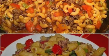 Spaghetti mit Hackfleisch und buntem Gemüse auf einem Teller serviert