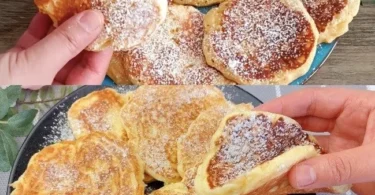 Ein Teller mit frisch gebackenen Apfelpfannkuchen, garniert mit Zimt und Puderzucker.