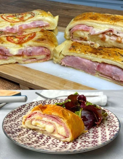 Blätterteig Strudel gefüllt mit Schinken und Käse auf einem Holzbrett