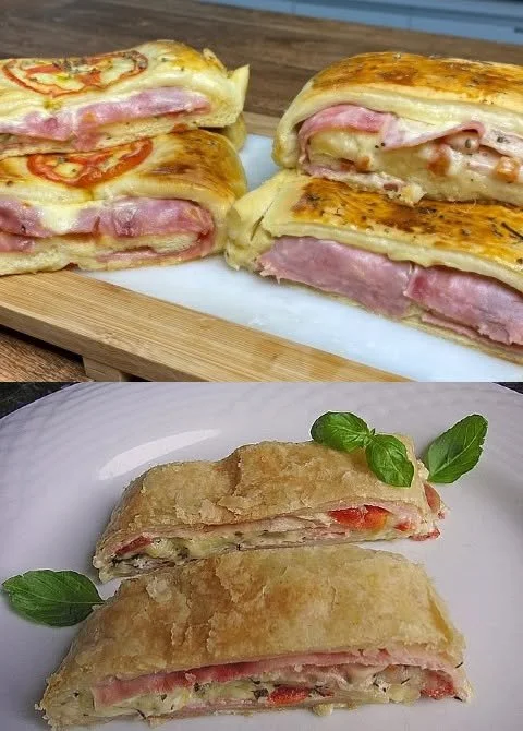 Blätterteigstrudel mit Schinken und Käse auf einem Teller