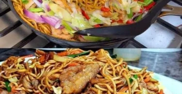 Chinesische Nudeln mit Hühnchen auf einem Teller serviert