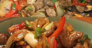 Chinesisches Rindfleisch mit Zwiebeln und Paprika auf einem Teller serviert