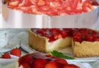 Erdbeer-Käsekuchen ohne Backen auf einem Teller mit frischen Erdbeeren