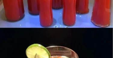 Erfrischende Erdbeerlimonade in einem Glas mit frischen Erdbeeren und Minze