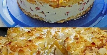 Himbeertorte mit frischen Himbeeren und Sahne dekoriert
