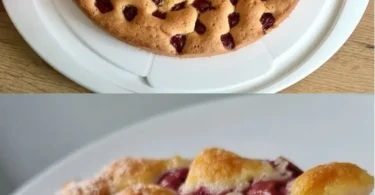 Leckeres Stück Kirschkuchen auf einem Teller mit frischen Kirschen