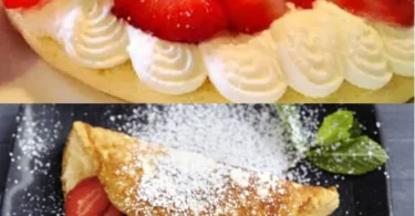 Schaumomelette mit frischen Erdbeeren auf einem Teller serviert.