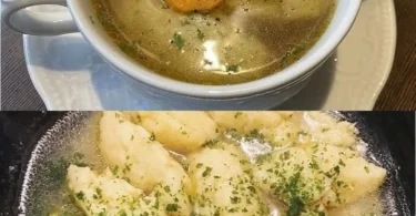 Hausgemachte Semmelknödel auf einem weißen Teller serviert.