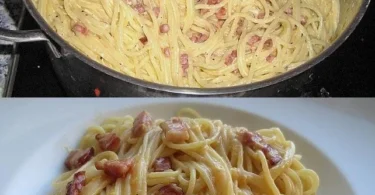 Traditionelle Spaghetti Carbonara im Südtiroler Stil serviert mit Speck und Parmesan.