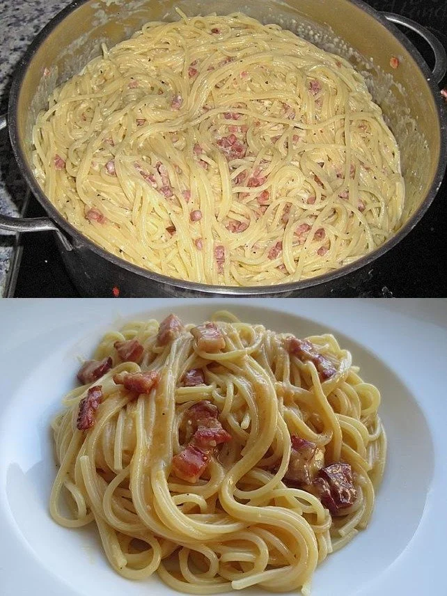 Traditionelle Spaghetti Carbonara im Südtiroler Stil serviert mit Speck und Parmesan.