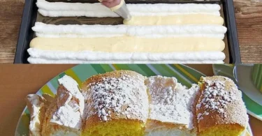 Biskuitrolle mit Aprikosenmarmelade und Kaffee-Sahne auf einem Teller