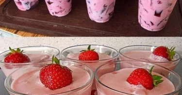 Erdbeer-Joghurt-Dessert in einer Schale mit frischen Erdbeeren garniert