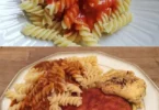 Gebratene Bologna mit Makkaroni auf einem Teller serviert