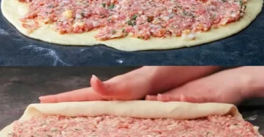 Leckere Hackfleisch-Rolle auf einem Teller mit frischen Kräutern garniert.