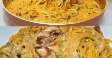 Pasta mit Pilz-Rahmsoße auf einem Teller, garniert mit frischen Kräutern
