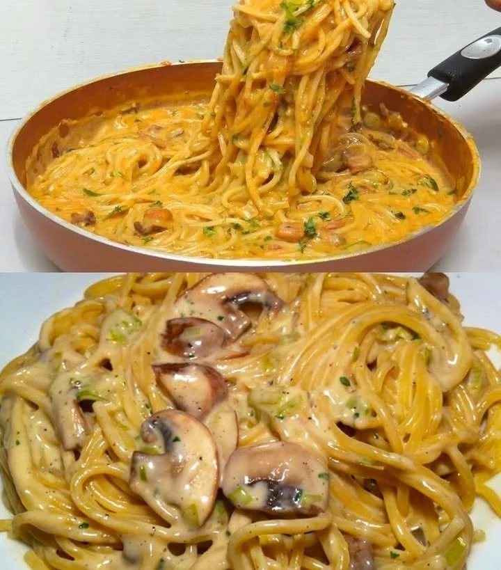Pasta mit Pilz-Rahmsoße auf einem Teller, garniert mit frischen Kräutern