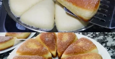 Frisches Quarkgebäck auf einem Teller mit Früchten und Puderzucker