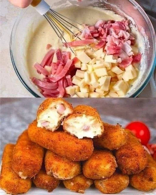 Schinken-Käse-Kroketten auf einem Teller garniert mit frischen Kräutern