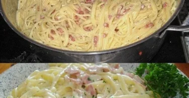 Eine Portion Spaghetti alla Carbonara mit Speck und Parmesan auf einem Teller
