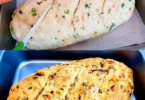 Frisches Speltbrot auf einem Holzbrett, perfekt für gesunde Ernährung.
