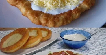 Ungarische Langos mit Knoblauchcreme und Käse serviert auf einem Teller