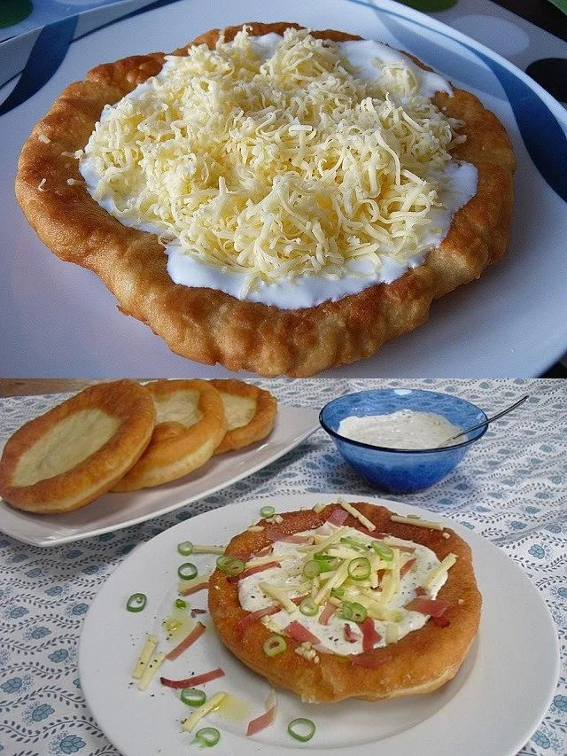 Ungarische Langos mit Knoblauchcreme und Käse serviert auf einem Teller