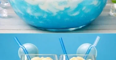 Eis Königin Cocktail in einem eleganten Glas mit Eiswürfeln und frischen Früchten