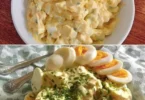 Omas Knoblauch-Eiersalat in einer Schüssel serviert, frisch zubereitet.