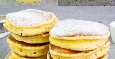 Leckere Pfannkuchen mit frischen Früchten und Sirup serviert.