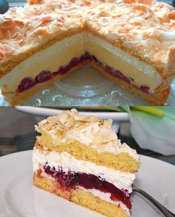 Schokoladen-Biskuitkuchen mit Meringue und Kirschen auf einem eleganten Teller