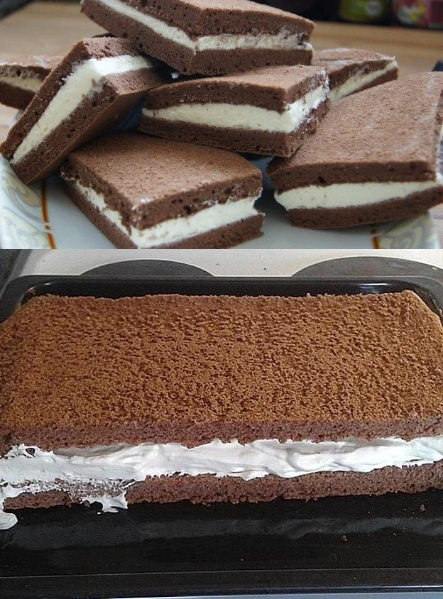 Leckerer Schokoladenkuchen mit Sahne auf einem Teller serviert