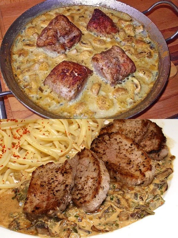 Schweinefilet mit Senf-Sauce und Champignons auf einem Teller serviert.