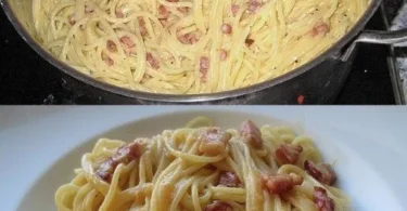 Ein Teller Spaghetti Carbonara mit Speck, Parmesan und frischem Pfeffer.