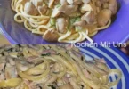 Spaghetti mit Pilz-Parmesan-Sauce auf einem Teller serviert