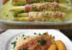 Spargel mit Schinken und cremiger Sauce auf einem Teller serviert