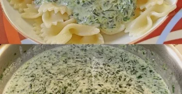 Schüssel mit Spinat-Cremekäse-Sauce auf einem Holzbrett