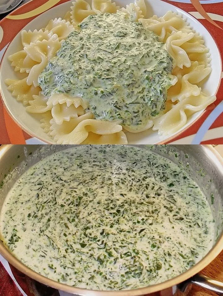 Schüssel mit Spinat-Cremekäse-Sauce auf einem Holzbrett