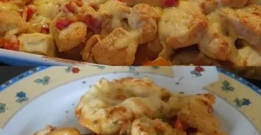 Tortellini mit Hähnchen und Paprika auf einem Teller serviert