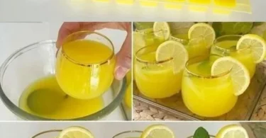 Zuckerfreie Zitronenlimonade mit Zitroneneiswürfeln in einem Glas