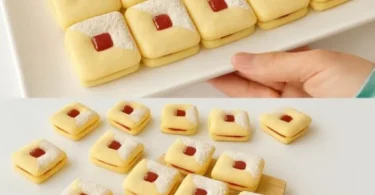 Kekse mit Marmelade auf einem Teller serviert