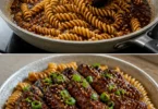 Klebriges Honig-Knoblauch-Steak mit Rotini auf einem Teller