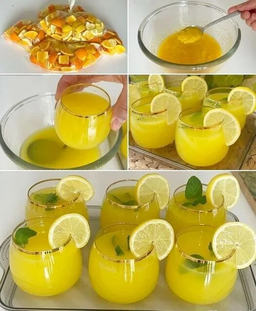 Erfrischende Limonade in einem Glas mit Zitronenscheiben und Minze
