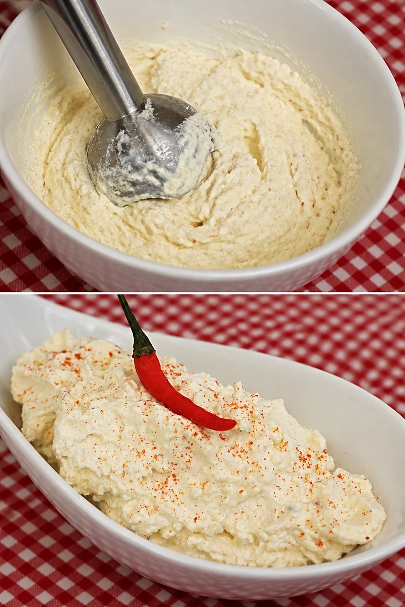 Cremiger Schafskäse Chtipití auf einem rustikalen Holzbrett angerichtet.